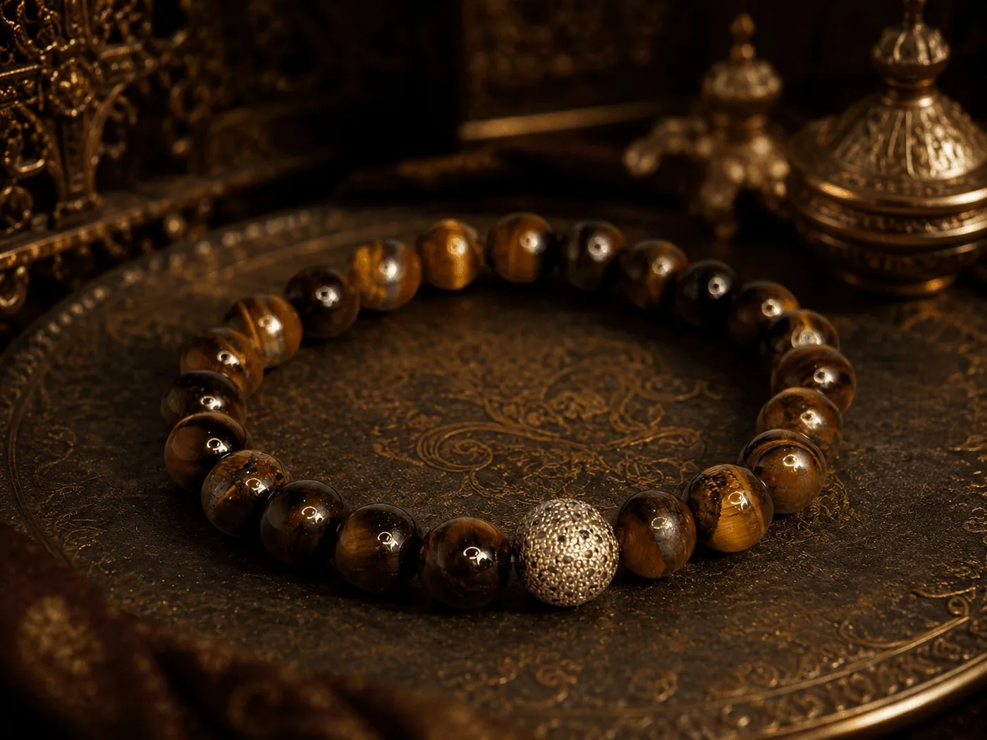 Tiger eye bead bracelet on an ornate brass plate